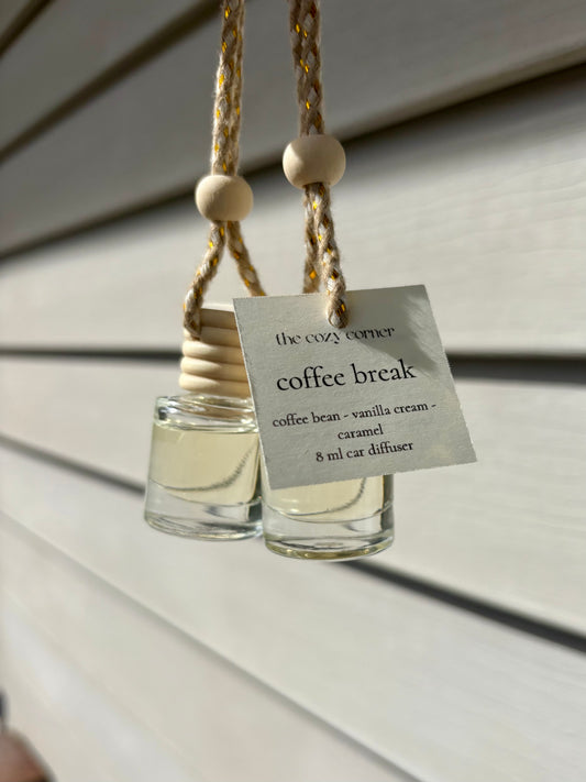 Two glass diffusers with wooden beads hanging on a string, labeled 'coffee break'.