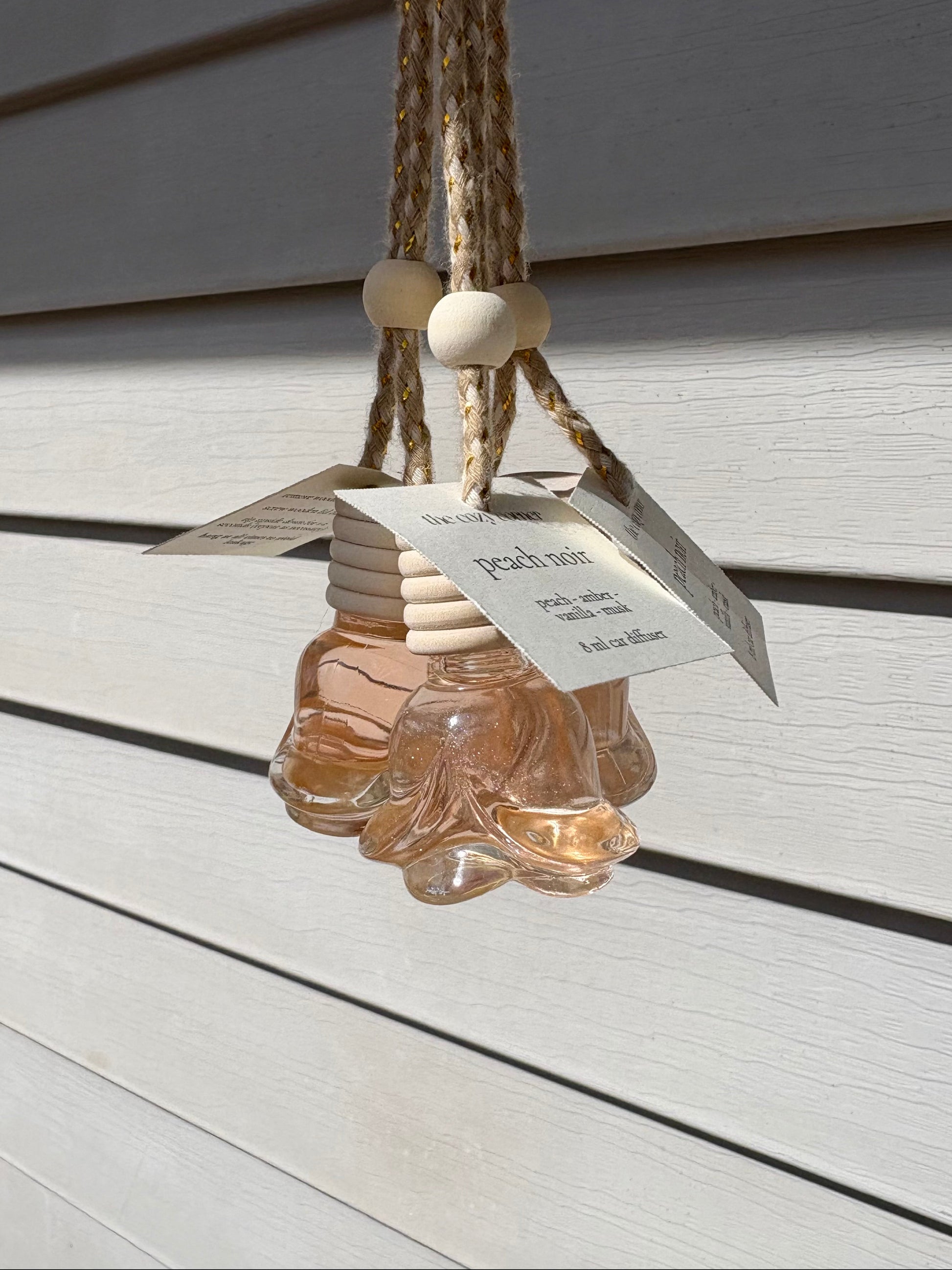 Decorative hanging item with a label on a wooden surface